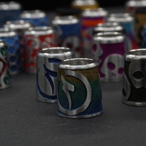 Collection of hand-decorated Sasquach aluminium golf ferrules in enamelled patterns